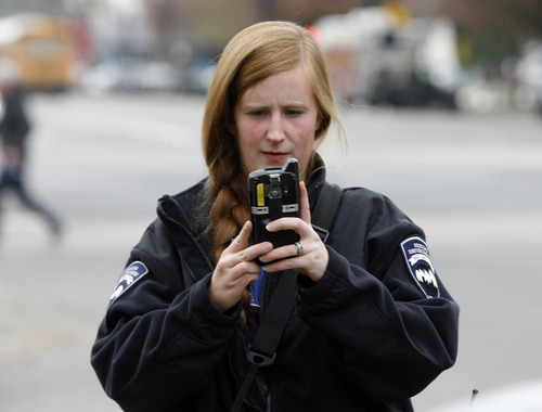 Rick Egan  | The Salt Lake Tribune 

Parking enforcement officer Jen Farrell, takes a photo of a car that is in violation of the law, before issuing a ticket, Friday, November 16, 2012.