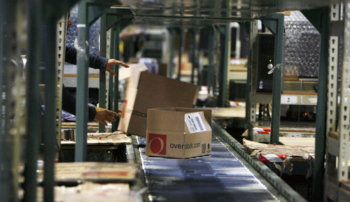 Francisco Kjolseth  |  The Salt Lake Tribune
A belt is fed boxes filled with all sorts of products as employees at Overstock.com's distribution center in Salt Lake City speed through online shipping orders on Friday, November 23, 2012.
