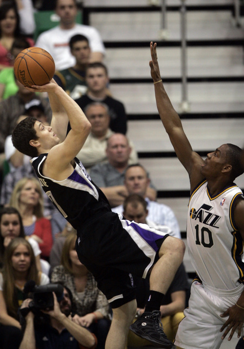 Kim Raff | The Salt Lake Tribune
Jazz player Alec Burks defends as Kings player Jimmer Fredette takes a shot during a game at EnergySolutions Arena in Salt Lake City, Utah on March 30, 2012. The Jazz went on to lose the game 103-104.
