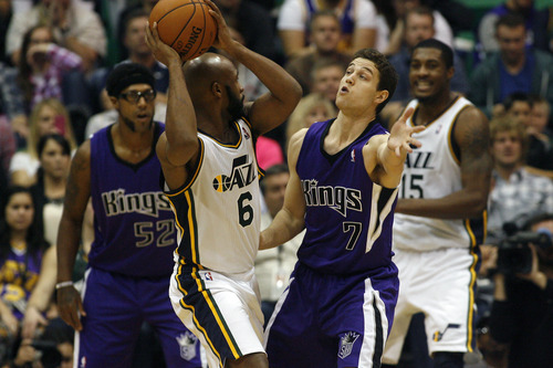 Chris Detrick  |  The Salt Lake Tribune
Sacramento Kings point guard Jimmer Fredette (7) guards Utah Jazz point guard Jamaal Tinsley (6) during the fourth quarter of the game at EnergySolutions Arena Friday November 23, 2012.  The Jazz won the game 104-102.