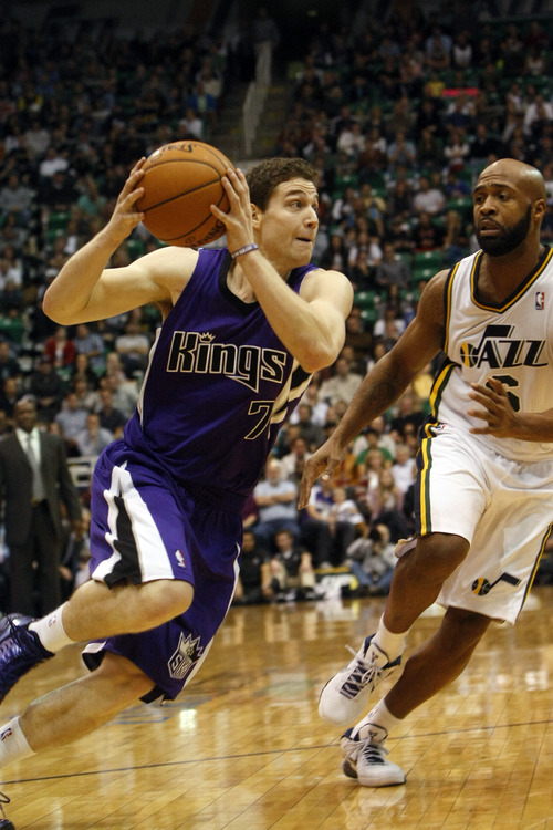 Chris Detrick  |  The Salt Lake Tribune
Sacramento Kings point guard Jimmer Fredette (7) runs past Utah Jazz point guard Jamaal Tinsley (6) during the fourth quarter of the game at EnergySolutions Arena Friday November 23, 2012.  The Jazz won the game 104-102.