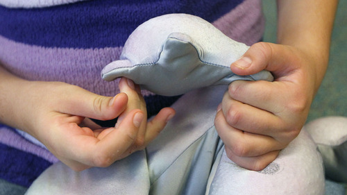 Al Hartmann  |  The Salt Lake Tribune
A student comforts herself by touching soft material at Whittier Elementary School. The school has a unique special needs wrap-around service hub that features a sensory room and a physical therapy room to accomodate the needs of Whittier's disabled students.
