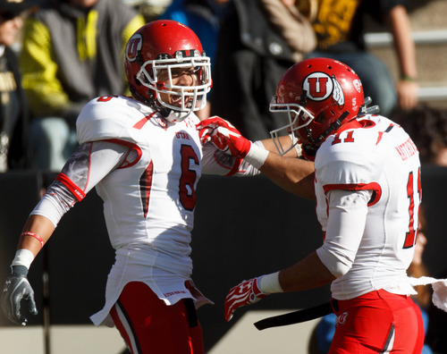 Trent Nelson  |  The Salt Lake Tribune
Utah Utes wide receiver Dres Anderson (6) celebrates his first quarter touchdown with teammate wide receiver Luke Matthews (11) as the Colorado Buffaloes host the University of Utah Utes, college football Friday November 23, 2012 in Boulder.