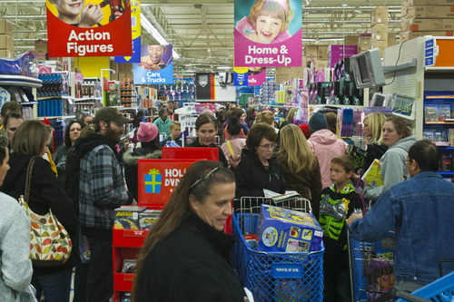 Chris Detrick  |  The Salt Lake Tribune
People shop at Toys"R"Us after they opened at 8:00pm in Murray Thursday November 22, 2012.