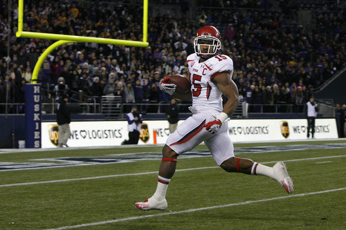 Scott Sommerdorf  |  The Salt Lake Tribune              
Utah RB John White looks back to see he is all alone as he heads into the end zone with a 46 yard TD run to give the Utes an early lead. Utah led 8-7 Washington halfway through the second quarter at Century Link Field in Seattle, Saturday, November 10, 2012.