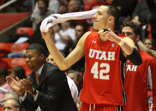 Rick Egan  | The Salt Lake Tribune 

Utah Utes center Jason Washburn (42) celebrates as the Utes take big lead in the second half, Saturday, November 24, 2012. The Utes defeated the Wright State Raiders, 66-54, in the Thanksgiving Tournament at the Huntsman Center,