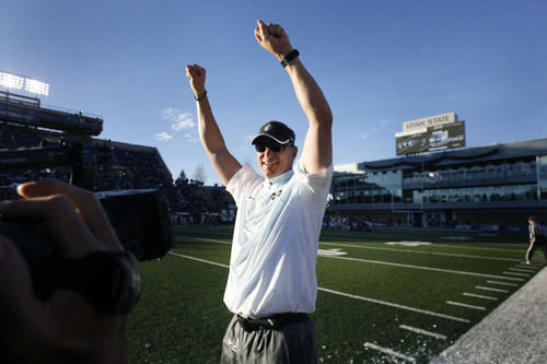Scott Sommerdorf  |  The Salt Lake Tribune              
Utah State Aggies head coach Gary Andersen celebrates winning the WAC championship on the sidelines in the closing seconds of their win over Idaho. Utah State defeated Idaho 45-9 in Logan, Saturday, November 24, 2012 to become champions of the WAC.