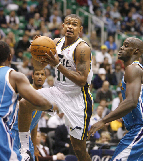 Paul Fraughton  |  The Salt Lake Tribune Utah Jazz point guard Earl Watson (11)drives to the basket and passes the ball to an open Utah Jazz shooting guard Raja Bell (19) for a three point play.The Utah Jazz played the New Orleans Hornets at Energy Solutions Arena  on , Thursday  March 24, 2011