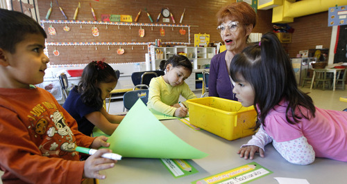 Al Hartmann  |  The Salt Lake Tribune
Grandma and volunteer Gayle Cowan, right, works with a group of preschoolers in an art project at Neighborhood House. Neighborhood House has been serving families in Salt Lake City for years and has the state's only accredited, private, year-round nonprofit preschool.