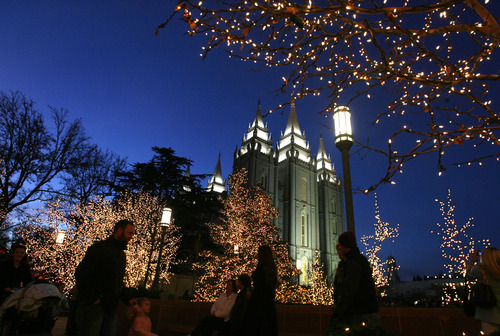 Scott Sommerdorf  |  The Salt Lake Tribune              
Visitors to Temple Square take in the lighting of the holiday display there, Friday, November 23, 2012.