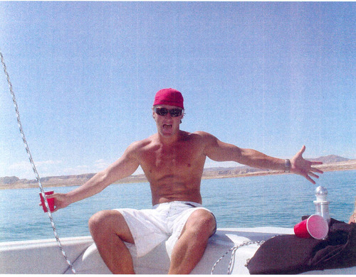 In this undated photograph, Jason Derek Brown shows off on a boat. Brown is on the FBI's list of most wanted fugitives for the 2008 robbery and murder of an armored car guard in Arizona. Brown previously lived in Salt Lake City. Photo courtesy Arizona Republic.