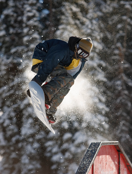 Trent Nelson  |  The Salt Lake Tribune
A snowboarder jumps off a rail on opening day at Brighton Ski Resort, Tuesday, Nov. 13, 2012.