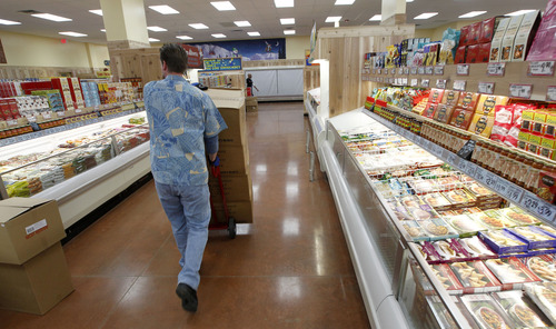 Al Hartmann  |  The Salt Lake Tribune
Trader Joe's employees stock shelves and organize the new 12,700-square-foot store at 634 E. 400 South in Salt Lake City on Wednesday, Nov. 28. It opens for business Nov. 30.