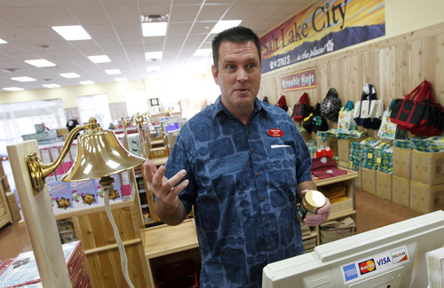 Al Hartmann  |  The Salt Lake Tribune
Rory Violette is the "captain" of Trader Joe's new 12,700-square-foot store at 634 E. 400 South in Salt Lake.  The bell by the cash registers is used to ring for help instead of an intercom system. The store opens for business Nov. 30.