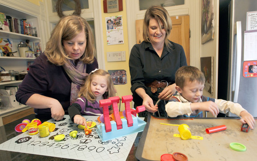 Al Hartmann  |  The Salt Lake Tribune
Lindsay Bartholomew, left, and Jennifer Levy play in the kitchen with their four-year-olds Emma and Hudson. The women run "Utah Easy to Love" a support group for families raising children with special needs. They hold monthly groups in Salt Lake City and Layton. Groups have topics, information, group speakers and support for families.