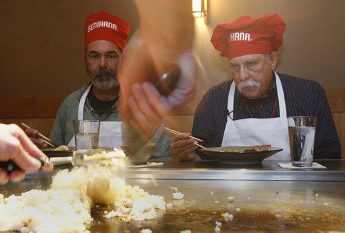 Leah Hogsten  |  The Salt Lake Tribune
Robert Kirby, right, and his friend Sonny Dyle learn how to fry rice from Patrick Ly, a longtime Benihana chef.