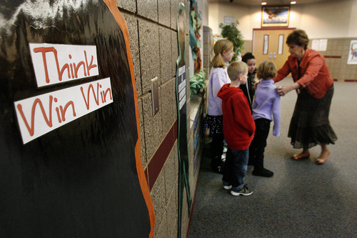 Scott Sommerdorf  |  The Salt Lake Tribune             
 Principal Karen Thomson arranges the student winners of this month's "The Leader in Me" program at Falcon Ridge Elementary for a group photograh that will be displayed, Monday, November 21, 2011. This school year is its second to implement "The Leader in Me" program - it's Franklin Covey's educational program in which kids are taught daily how to use the "7 habits of highly successful people."