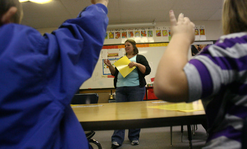 Steve Griffin | The Salt Lake Tribune


Adrienne Tupou works with second graders during her after school tutoring class at Pleasant Green Elementary School in Magna, Utah Wednesday November 14, 2012.