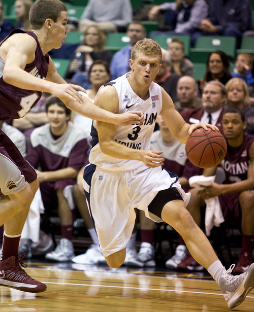 Lennie Mahler  |  The Salt Lake Tribune
BYU's Tyler Haws drives around Montana's Andy Martin in the Cougars' 85-60 win over the Grizzlies at EnergySolutions Arena, Wednesday, Nov. 28, 2012.