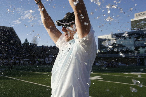 Scott Sommerdorf  |  The Salt Lake Tribune              
Utah State Aggies head coach Gary Andersen celebrates winning the WAC championship as his players shower him on the sidelines in the closing seconds 0f their win over Idaho. Utah State defeated Idaho 45-9 in Logan, Saturday, November 24, 2012 to become champions of the WAC.