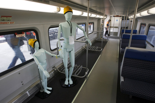 Francisco Kjolseth  |  The Salt Lake Tribune
Mannequins advise holding your child's hand while entering and exiting as media are invited to ride the new FrontRunner line from Salt Lake City to Provo on Friday, November 30, 2012, as UTA gets ready to open for regular service on Monday, December 10, 2012. The public is also welcome to try out the line as part of their "Food for your fare" on Saturday, December 8, 2012, from 10 a.m to 10 p.m by providing a non-perishable food item to be donated as "fare" to benefit the Utah Food Bank and the Community Action Services.