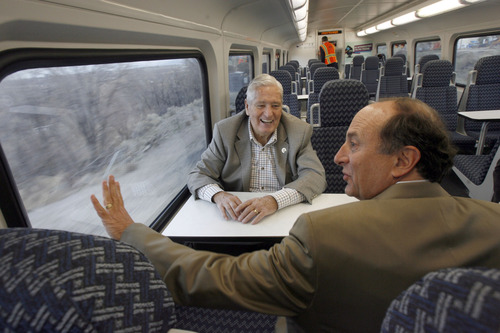 Francisco Kjolseth  |  The Salt Lake Tribune
UTA board member and vice chairman H. David Burton, left, and UTA General Manager Michael Allegra admire the work done as they ride the new FrontRunner line from Salt Lake City to Provo on Friday as UTA gets ready to open for regular service on Monday. The public is also welcome to try out the line as part of their "Food for your fare" on Saturday from 10 a.m to 10 p.m by providing a non-perishable food item to be donated as "fare" to benefit the Utah Food Bank and the Community Action Services.