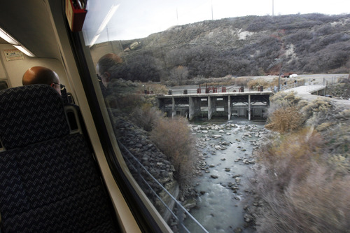 Francisco Kjolseth  |  The Salt Lake Tribune
The new FrontRunner train line from Salt Lake City to Provo affords new views including the South Jordan Narrows where 2 canals were relocated and difficult engineering practices were put to use as seen during a tour on Friday, November 30, 2012, as UTA gets ready to open for regular service on Monday, December 10, 2012. The public is also welcome to try out the line as part of their "Food for your fare" on Saturday, December 8, 2012, from 10 a.m to 10 p.m by providing a non-perishable food item to be donated as "fare" to benefit the Utah Food Bank and the Community Action Services.