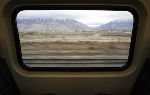 Francisco Kjolseth  |  The Salt Lake Tribune
Utah county blurs by as the new FrontRunner train line from Salt Lake City to Provo affords nice views of the mountains on Friday, November 30, 2012, as UTA gets ready to open for regular service on Monday, December 10, 2012. The public is also welcome to try out the line as part of their "Food for your fare" on Saturday, December 8, 2012, from 10 a.m to 10 p.m by providing a non-perishable food item to be donated as "fare" to benefit the Utah Food Bank and the Community Action Services.