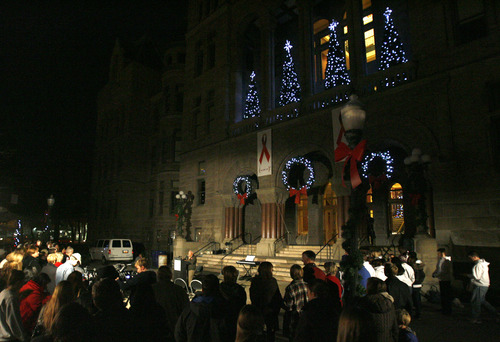 Rick Egan  | The Salt Lake Tribune 

Crowds gather at Washinton Square in recognition of World AIDS Day at the City-County Building, Saturday, December 1, 2012.The culmination of the event is a red lighting of the City & County Building and a bell-ringing tribute to those who have lost their lives to HIV/AIDS and those who continue to be affected by the disease.