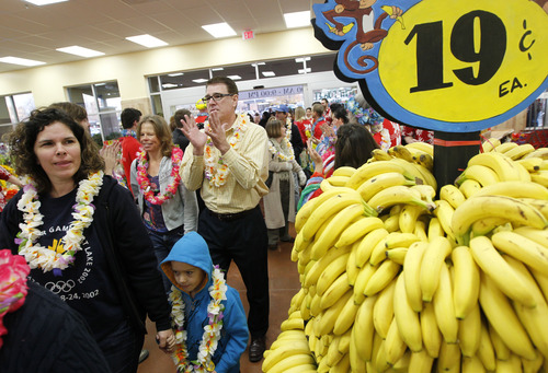 Al Hartmann  |  The Salt Lake Tribune
Customers pour through the doors at Trader Joe's into a party atmosphere for the opening of the new store at 634 East 400 South in Salt Lake City Friday November 30 at 8 a.m.
