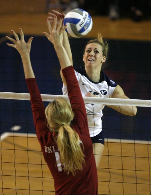 Rick Egan  | The Salt Lake Tribune 

Nicole Warner (15) spikes the ball as BYU faced Oklahoma in women's NCAA volleyball action at the Smith Fieldhouse in Provo, Saturday, December 1, 2012.