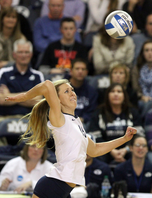 Rick Egan  | The Salt Lake Tribune 

Nicole Warner spikes the ball for the Cougars, as BYU faced Oklahoma in NCAA  volleyball action at the Smith Fieldhouse in Provo, Saturday, December 1, 2012.