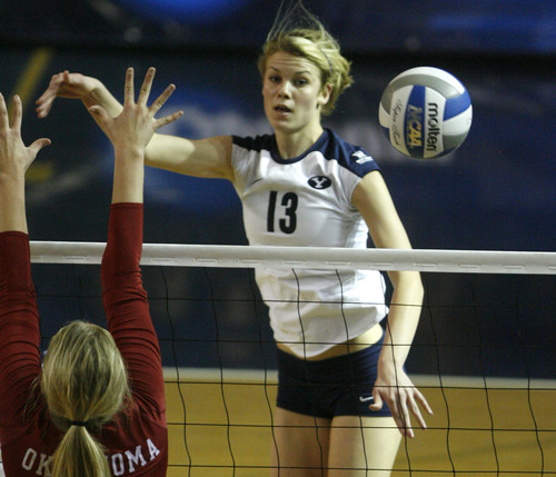 Rick Egan  | The Salt Lake Tribune 

Kimberly Dahl (13) spikes the ball as BYU faced Oklahoma in women's NCAA volleyball action at the Smith Fieldhouse in Provo, Saturday, December 1, 2012.