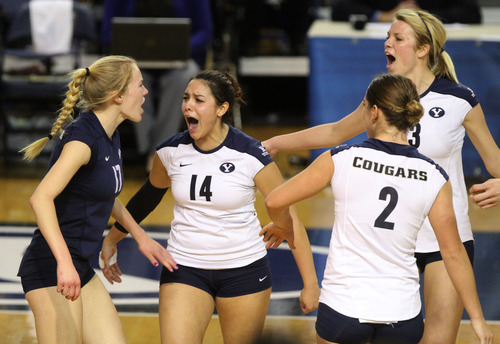 Rick Egan  | The Salt Lake Tribune 

Tia Withers (17) Ciara Parker (14) Heather Hannemann (2) and Kimberly Dahl (13) celebrate after BYU scored a big point in game 3, as BYU faced Oklahoma in women's NCAA volleyball action at the Smith Fieldhouse in Provo, Saturday, December 1, 2012.