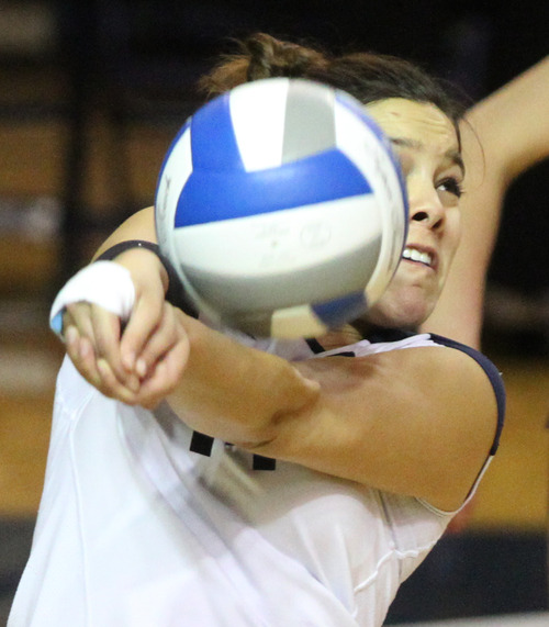 Rick Egan  | The Salt Lake Tribune 

Ciara Parker (14) hits the ball as BYU faced Oklahoma in women's NCAA volleyball action at the Smith Fieldhouse in Provo, Saturday, December 1, 2012.