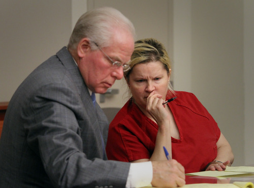 Rick Egan  |  The Salt Lake Tribune 
Janeen Lundberg speaks with her attorney, John Walsh, during her preliminary hearing in Judge Elizabeth Hruby-Mills' courtroom at the Matheson Courthouse, Friday, November 30, 2012. Lundberg is charged with automobile homicide, for allegedly driving under the influence of sedatives when she hit and killed 6-year-old Ambrosia Amalathithada-Ramseyer, who was walking with her mother in a crosswalk on State Street in Salt Lake City.