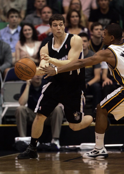 Kim Raff | The Salt Lake Tribune
Kings player Jimmer Fredette passes the ball past Jazz player Earl Watson during the game at EnergySolutions Arena in Salt Lake City, Utah on March 30, 2012.