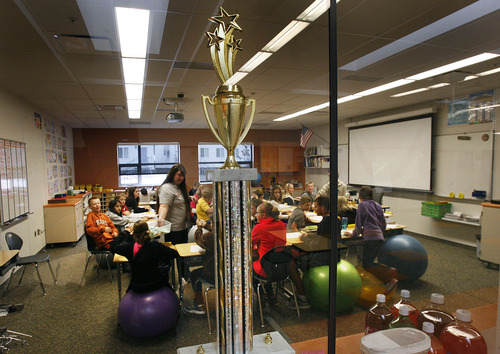 Scott Sommerdorf  |  The Salt Lake Tribune              
A traveling trophy recognizing reading skills is seen through a window at Endeavour Elementary School in Kaysville. Utah recently released new accountability data for all Utah public schools, and Endeavour Elementary has the third-highest score in the state under the system.
