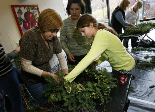 Scott Sommerdorf  |  The Salt Lake Tribune              
Dana Lombardi, left, and her daughter Miriam Smith work on a wreath together during a wreath-making class led by Scott Mower at Red Butte Garden, Sunday, December 2, 2012.