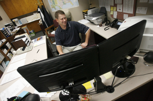 Francisco Kjolseth  |  The Salt Lake Tribune
Brandon Nelson, Accounting Division Manager for the City of Orem administration department works behind two screens recently. The City of Orem has UTOPIA service which provides high speed internet services.
