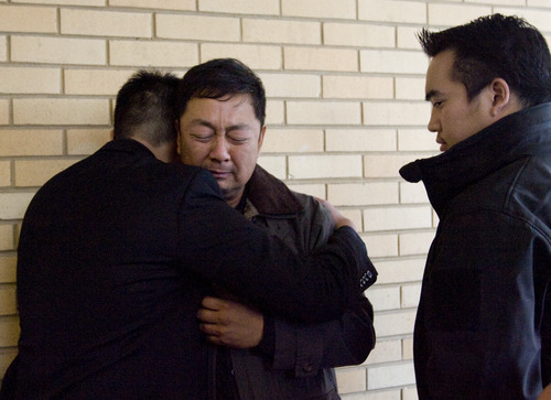 Kim Raff  |  The Salt Lake Tribune
Don Phan, left, brother of 14-year-old David Phan, comforts his father, Nhuan Phan, on Sunday during the family's first public comments on David's suicide. The family said through a spokesman that David had shielded them from the horror he was experiencing, including from bullying.
