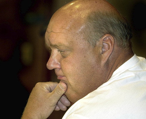 Coach Rick Majerus at today's press conference dealing with NCAA violations and sanctions. photo: fraughton 7/30/03