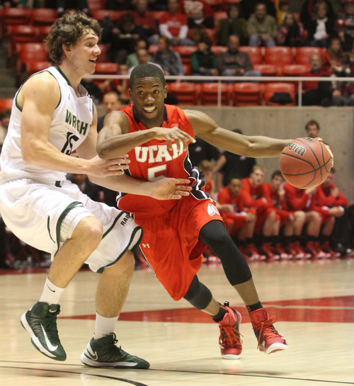 Rick Egan  | The Salt Lake Tribune 

Utah Utes guard Jarred DuBois (5) takes the ball inside, as Wright State Raiders guard Kendall Griffin (15) defends, in the Thanksgiving Tournament at the Huntsman Center, Saturday, November 24, 2012.