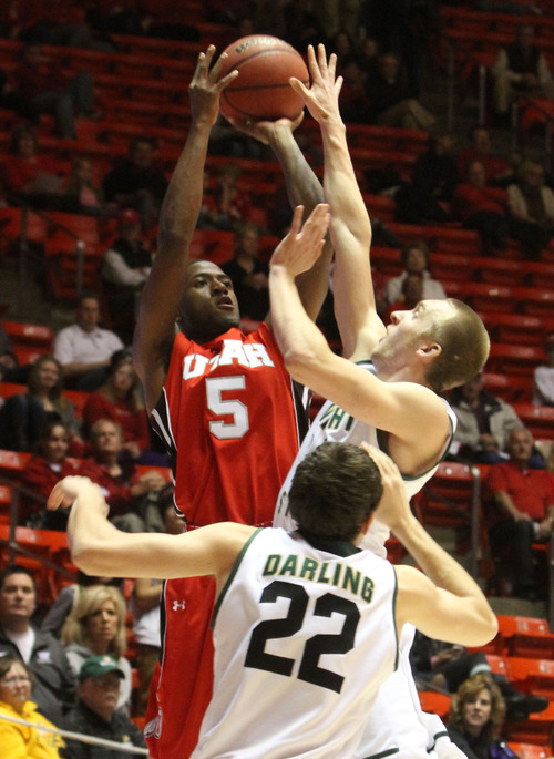 Rick Egan  | The Salt Lake Tribune 

Utah Utes guard Jarred DuBois (5) is double teamed by Wright State Raiders forward Cole Darling (22) and Wright State Raiders guard Matt Vest (24) in the Thanksgiving Tournament at the Huntsman Center, Saturday, November 24, 2012.