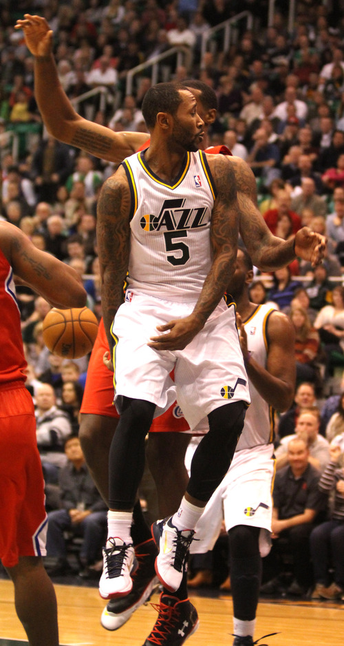 Rick Egan  | The Salt Lake Tribune 

Utah Jazz point guard Mo Williams (5)gets an assist with a behind-the-back pass  in NBA action. The Los Angeles Clippers beat the Jazz 105-104, in Salt Lake City, Monday, December 3, 2012.
