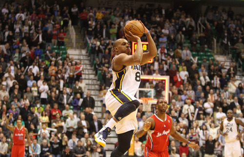Rick Egan  | The Salt Lake Tribune 

Utah Jazz point guard Randy Foye (8) takes a shot as the buzzer goes off, in NBA action. The Los Angeles Clippers beat the Jazz 105-104, in Salt Lake City, Monday, December 3, 2012.