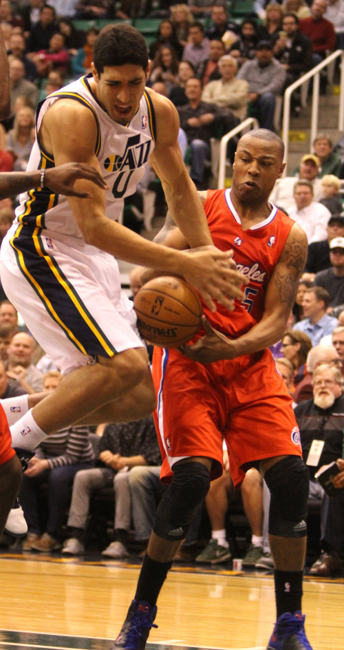 Rick Egan  | The Salt Lake Tribune 

Los Angeles Clippers small forward Caron Butler (5) grabs the ball from Utah Jazz center Enes Kanter (0) in NBA action. The Los Angeles Clippers beat the Jazz 105-104, in Salt Lake City, Monday, December 3, 2012.