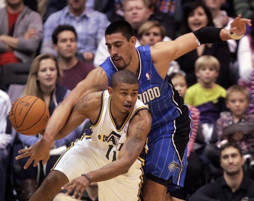 Kim Raff  |  The Salt Lake Tribune
Utah Jazz point guard Earl Watson (11) steals the ball from Orlando Magic center Nikola Vucevic (9) during a game at EnergySolutions Arena in Salt Lake City on December 5, 2012. Jazz went on to win 87-81.