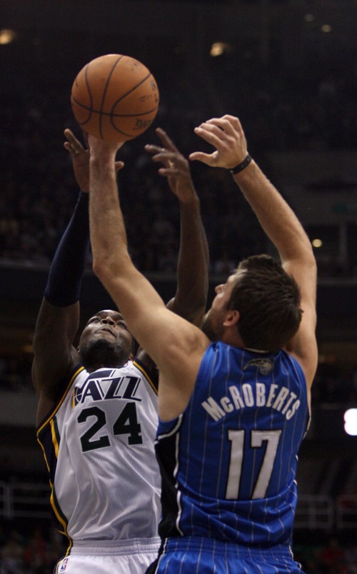 Kim Raff  |  The Salt Lake Tribune
Utah Jazz power forward Paul Millsap (24) and Orlando Magic power forward Josh McRoberts (17) compete for a rebound during a game at EnergySolutions Arena in Salt Lake City on December 5, 2012. Jazz went on to win 87-81.