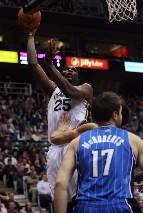 Kim Raff  |  The Salt Lake Tribune
(left) Utah Jazz center Al Jefferson (25) takes a shot over the head of (right) Orlando Magic power forward Josh McRoberts (17) during a game at EnergySolutions Arena in Salt Lake City on December 5, 2012. Jazz went on to win 87-81.